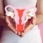 woman holding a uterus model