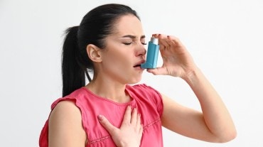 woman using inhaler