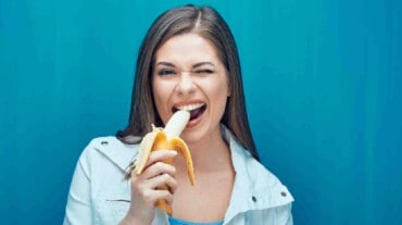 A woman eating a banana for period pain