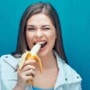 A woman eating a banana for period pain