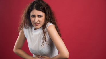 A woman using licorice root for menstruation