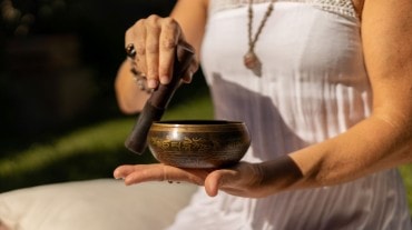 Women playing Tibetan singing bowls