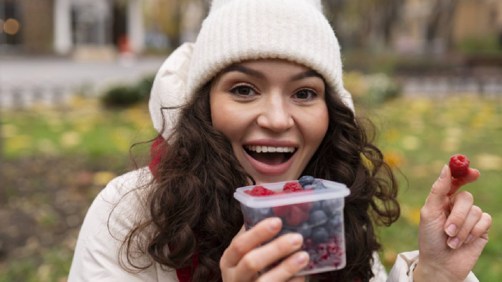 A girl eating berries